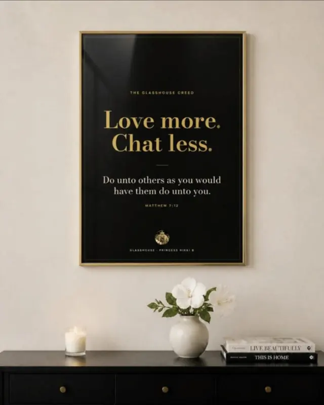 The Creed Poster framed on a wall: Love more. Chat less. and Do unto others as you would have them do unto you, Matthew 7:12, in gold on black