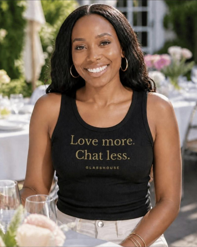The Creed Tank in black, worn: Love more. Chat less. in gold